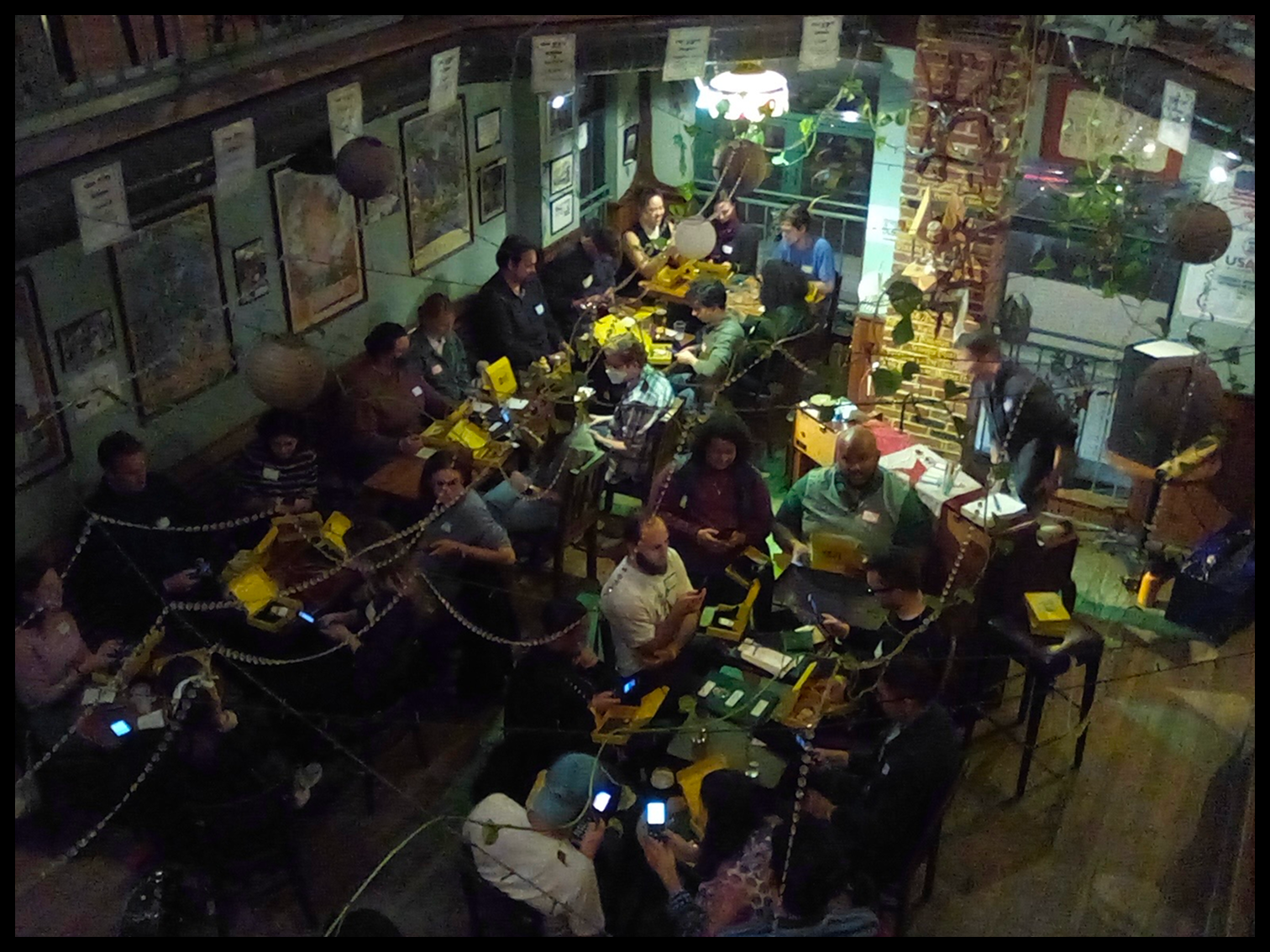 Participants seated at long tables during a Month Offline orientation meetup