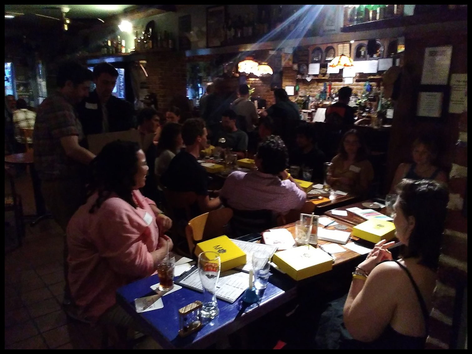 A Month Offline meetup gathered around a candlelit dinner table
