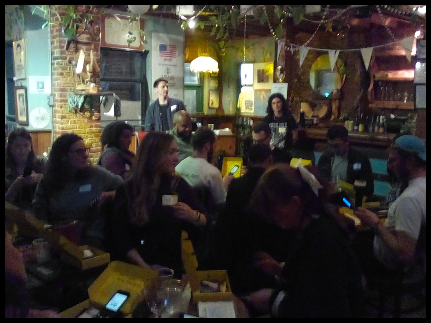 Month Offline participants gathered around a table at their meetup venue